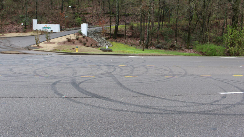 Circular tire marks cover a four-lane road in Crestwood.