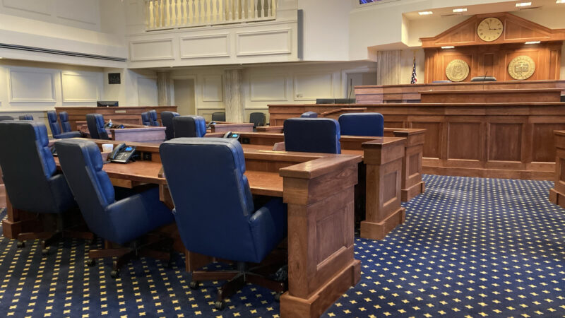 Empty seats in a senate chamber.