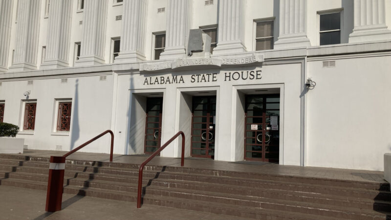 The doors to the state house with the text "Alabama State House" above them.