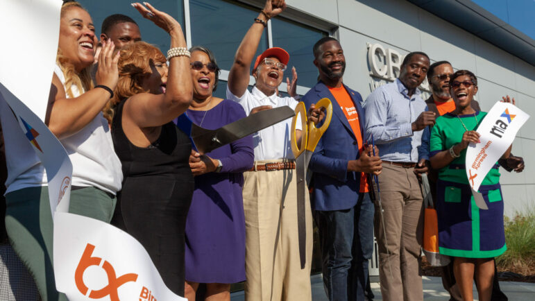 Birmingham city leaders celebrate after a ribbon-cutting ceremony for a new Xpress Rapid Bus Line on Thursday, Sept. 22, 2022, in Birmingham, Alabama.