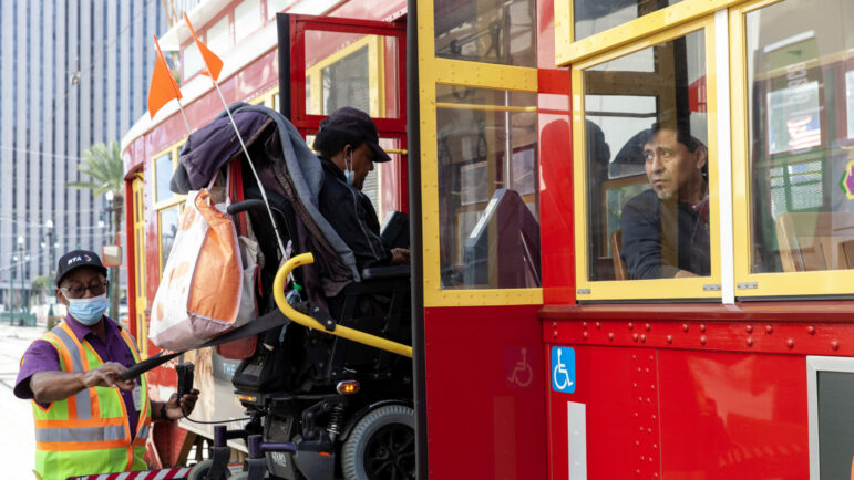 Riders load onto a streetcar on Jan. 19, 2023, in New Orleans, Louisiana. Streetcars are part of the city’s public transportation system that has become less frequent and dependable since Hurricane Katrina in 2005. The city is taking steps to make its bus system more robust by introducing Bus Rapid Transit lines.