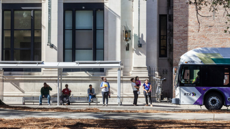 Riders wait for the bus on Jan. 19, 2023, in New Orleans, Louisiana. The public transportation system has become less frequent and dependable since Hurricane Katrina in 2005. The city is taking steps to make its bus system more robust by introducing Bus Rapid Transit lines.