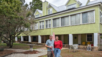 Matt Campbell and his wife Lea Campbell stand outside their home in Ocean Springs, Mississippi on December 17, 2022.