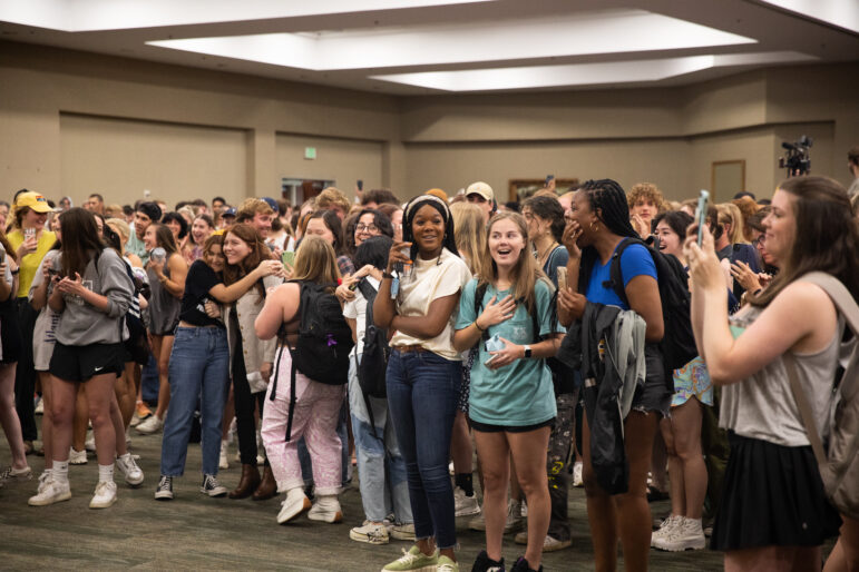 Students stand around in shock.