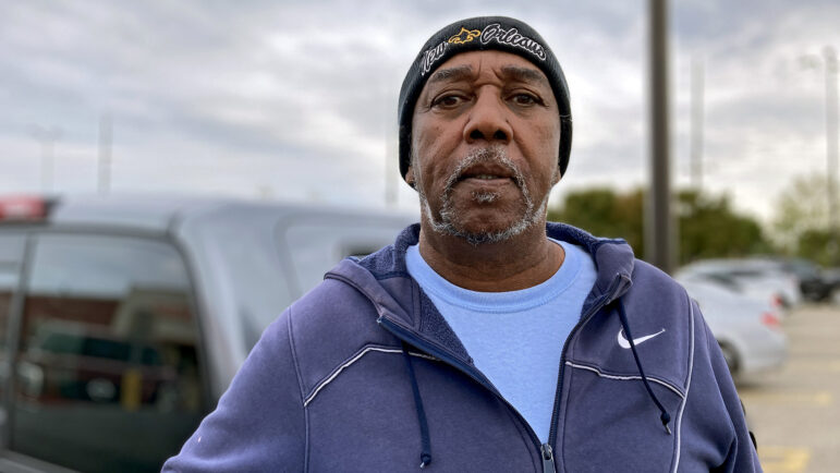 Larry Bowman waits outside a parking lot for two dollar stores in New Orleans East.