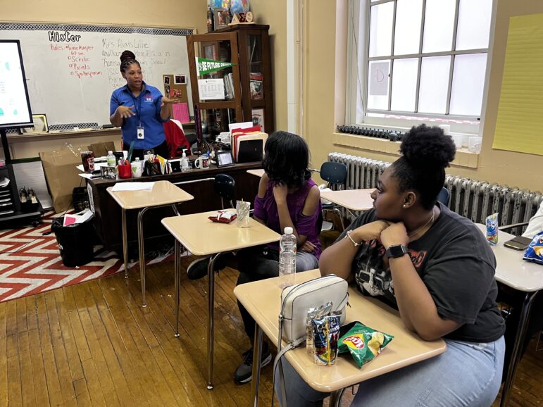 students sit in class in afterschool club