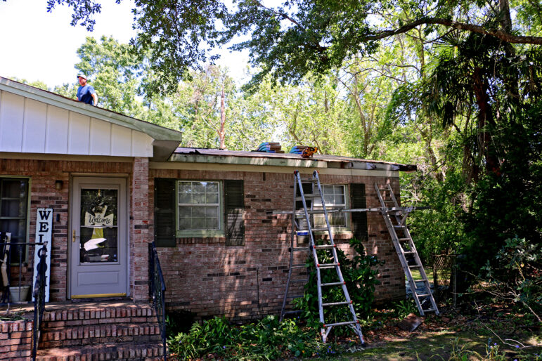 A construction crew installs a FORTIFIED roof on Karen Ellis’ home in Loxley, Alabama, on April 20, 2023.