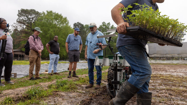USDA soil scientists and agricultural engineers prepare a demonstration of a no-till transplanter for a class on regenerative agriculture at DeLaTerre Permaculture Farm on April 3, 2023 in Eros, Louisiana.