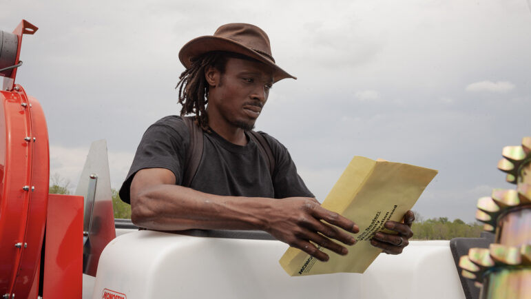 Bernard Winn, operations manager at Jubilee Justice, reads the instruction manual on the farm's newest piece of equipment on April 4, 2023, at Jubilee Justice on Inglewood Farm in Alexandria, Louisiana.