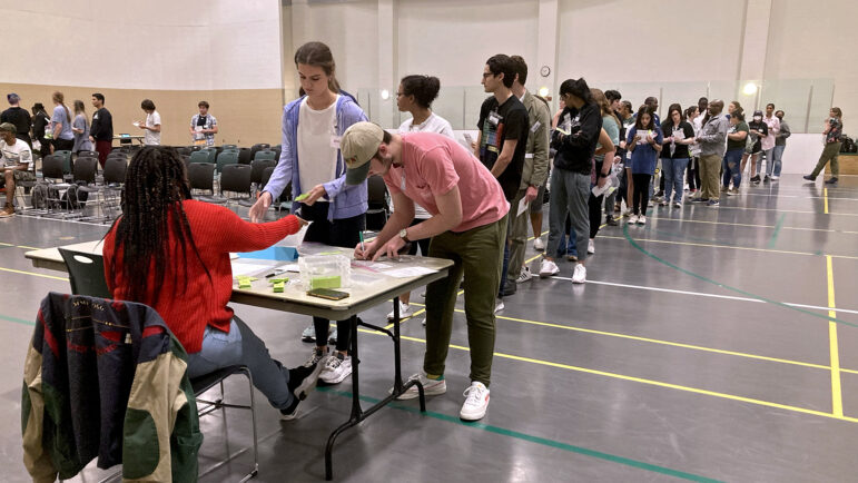 Participants line up to get a state ID during the reentry simulation at UAB’s recreation center, March 24, 2023.