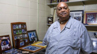 Herman Johnson Jr., director of the Mound Bayou Museum of African American Culture and History stands in an exhibit honoring Mississippi sports legends in Mound Bayou, Mississippi, on July 19, 2023.
