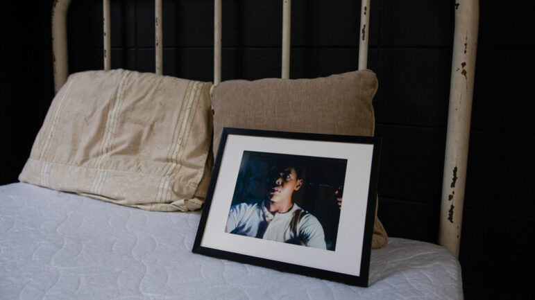 A photo from a show about the murder of Emmett Till sits on a bed at the Mound Bayou Museum of African American Culture and History in Mound Bayou, Mississippi, on July 19, 2023.