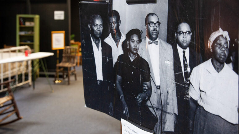(from left) A large photo of Walter Reed, Willie Reed, Mamie Till-Mobley, Charles Diggs, Dr. T.R.M. Howard and Amanda Bradley at the trial for Emmett Till’s murder stands inside of the Mound Bayou Museum of African American Culture and History in Mound Bayou, Mississippi.