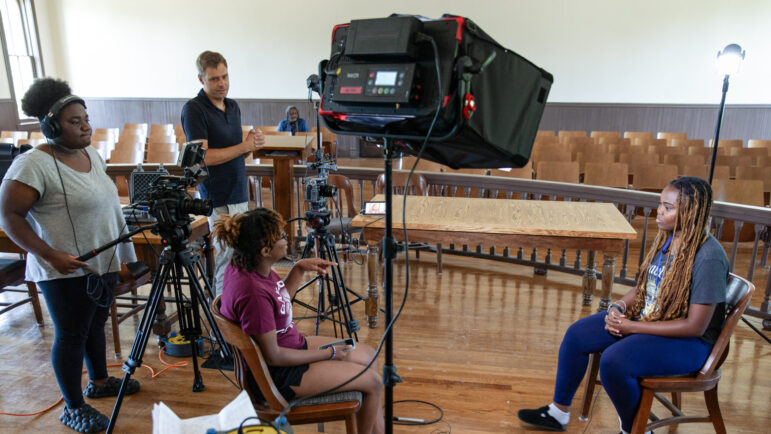 A group of students work on a documentary about their experiences learning about the life and death of Emmett Till at the Tallahatchie County Second District Courthouse in Sumner, Mississippi, on July 20, 2023.