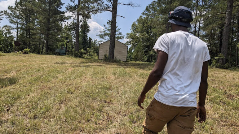 Markel Thompson walks up the hill towards the site of his future home on June 20, 2023, in McCool, Mississippi.