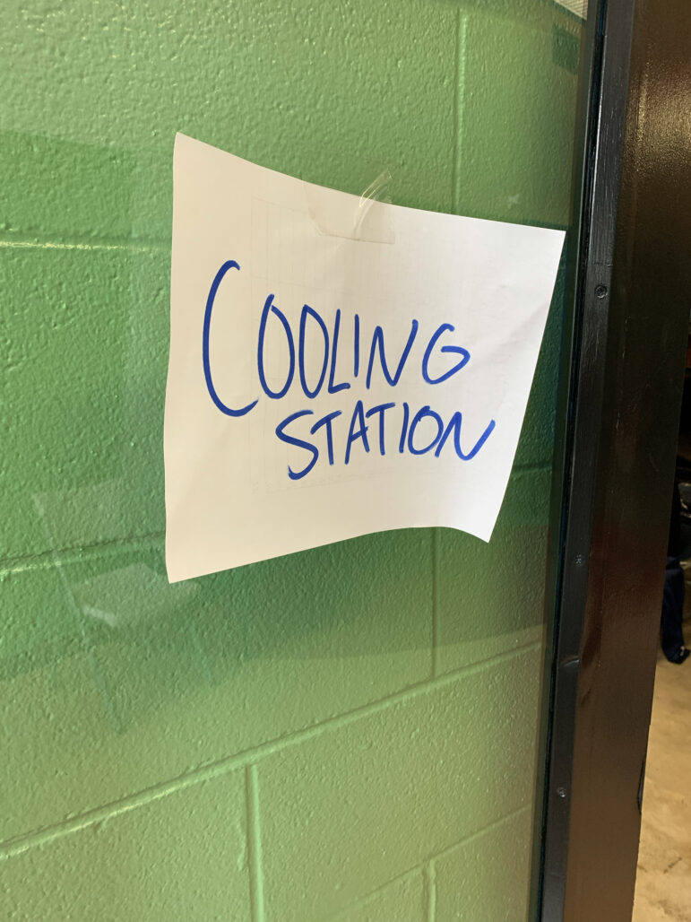 A sign points to the cooling center set up at the Rosenwald Recreational Center in New Orleans, Louisiana, on June 30, 2023.