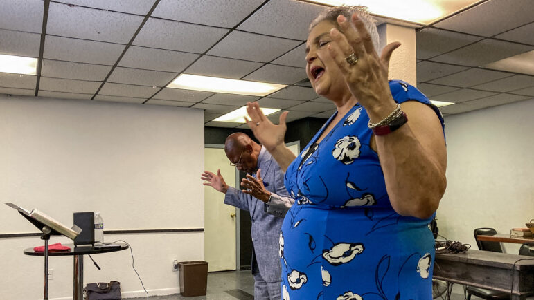 Gigi Robinson (right) and her husband Mike Robinson lead a church service at The Breath of Life Praise and Worship Center in Lake Charles, Louisiana, on July 16, 2023.