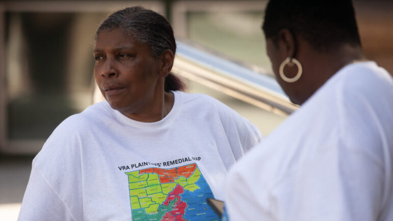 Laurie Helms, a plaintiff in a high-profile case arguing that Alabama's voting districts are not fair to Black voters, sits outside of a federal courthouse after the latest hearing in that case on Monday, August 14, 2023, in Birmingham, AL.