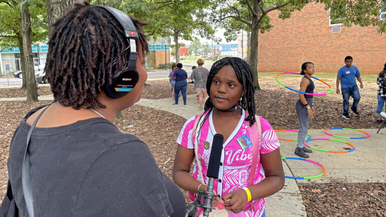 Gabriella, a Birmingham middle school student, talks with Gulf States Newsroom community engagement reporter Maya Miller outside of the Birmingham Civil Rights Institute on Sept. 14, 2023, during a field trip to commemorate the 60th anniversary of the 16th Street Baptist Church bombing.