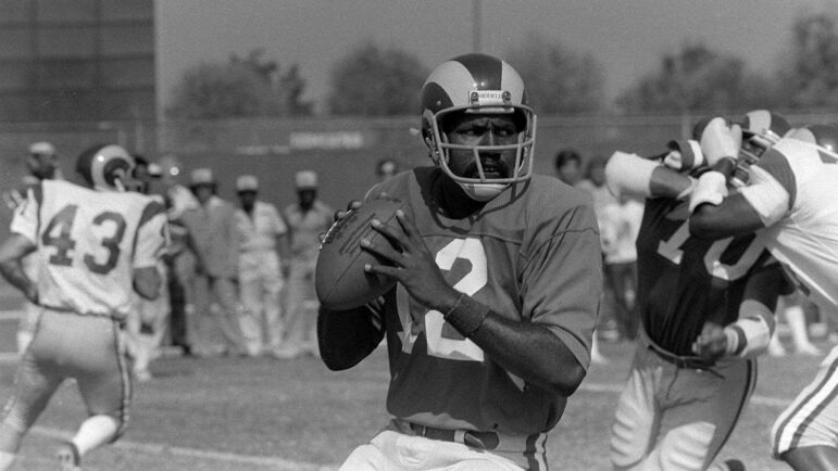 In this July 1, 1976, file photo, Los Angeles Rams quarterback James Harris is shown at the team's training camp in Fullerton, Calif.
