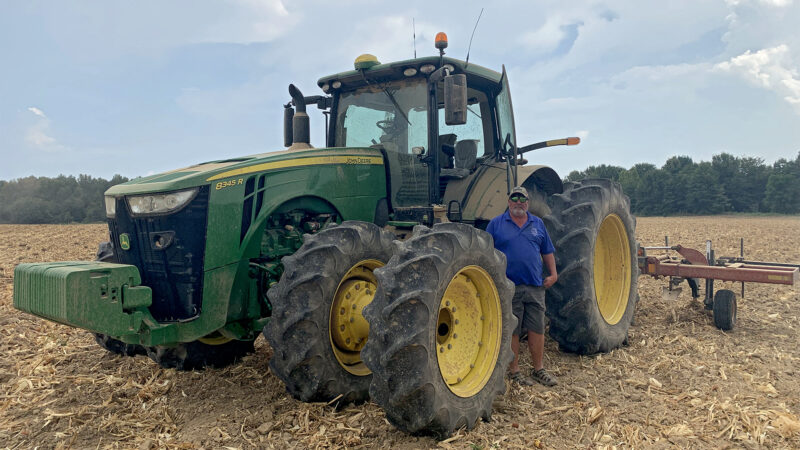 Steven Franklin stands next to his tractor in Crowville, Louisiana, on August 25, 2023.