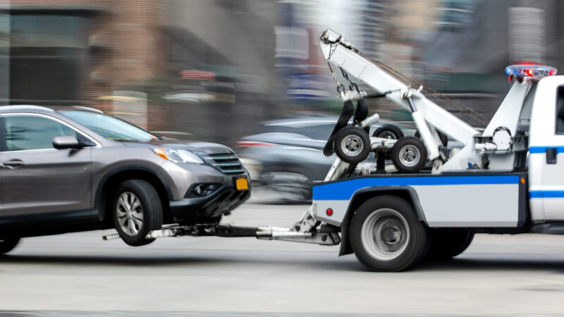 A tow truck pulls a vehicle