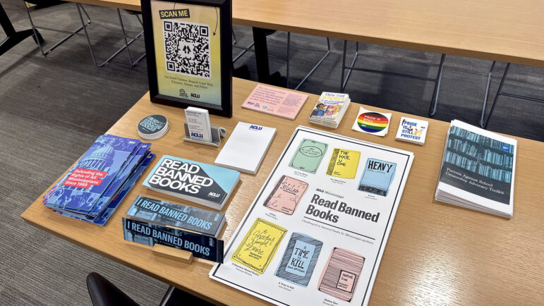 Materials on legal rights for LGBTQ+ students distributed by the ACLU of Mississippi sit on a table in the Fant Memorial Library at the University of Mississippi for Women in Columbus, Mississippi, on Oct. 4, 2023.