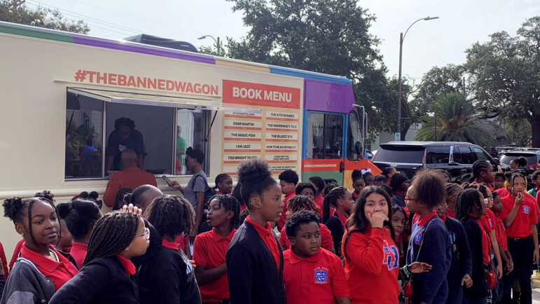 A group of 5th graders waits outside of the Banned Wagon at the [Un]Ban Book Festival at Baldwin & Co. in New Orleans on Oct. 5, 2023.
