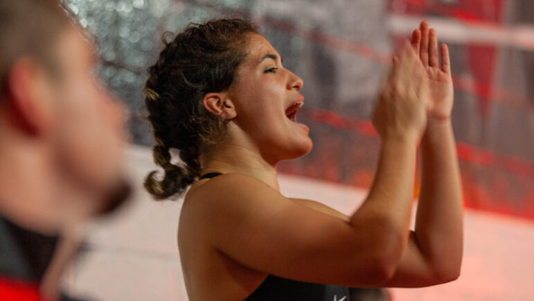 Freshman Myna Estrada cheers her team on during an intra-squad scrimmage to begin the 2023-2024 wrestling season for the Huntingdon Hawks women's wrestling team on Saturday, Oct. 14, 2023, at Huntingdon College in Montgomery, Alabama.