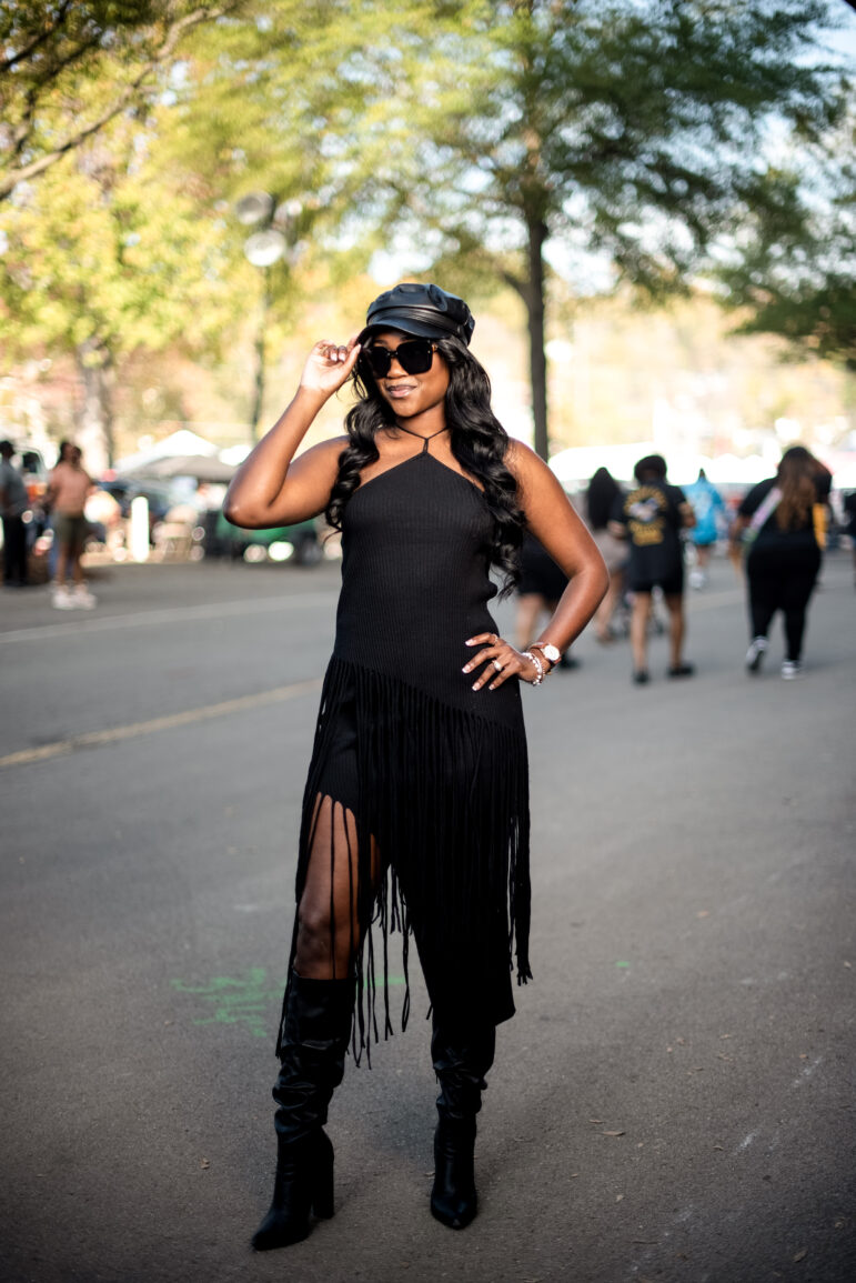 Reagan Brown wears a black dress with fringe to the Magic City Classic in Birmingham, Alabama, U.S., on Saturday October 28th 2023.