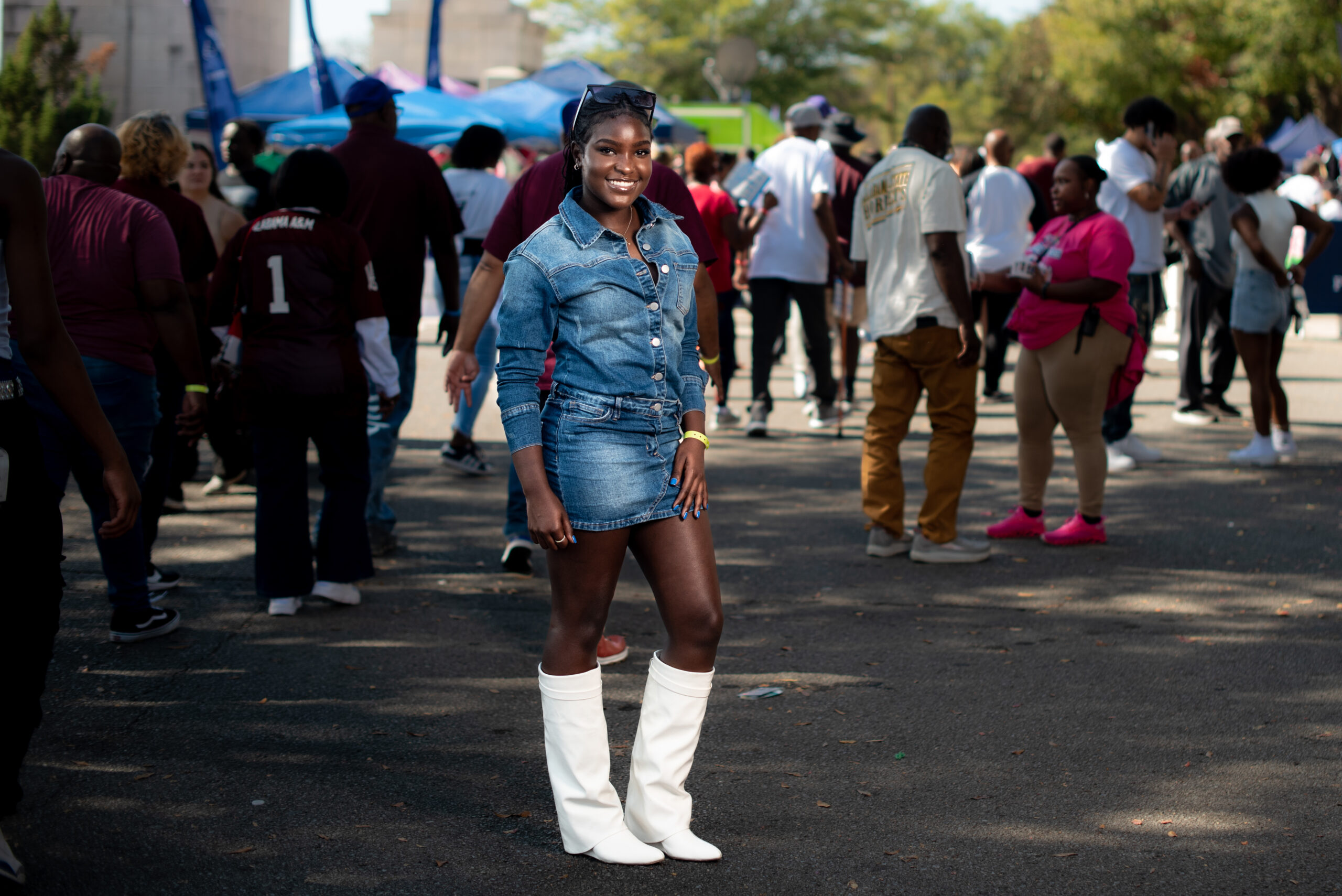 Kelsie Njuguna wears denim skirt with white boots at the Magic City Classic in Birmingham, Alabama, U.S., on Saturday October 28th 2023.