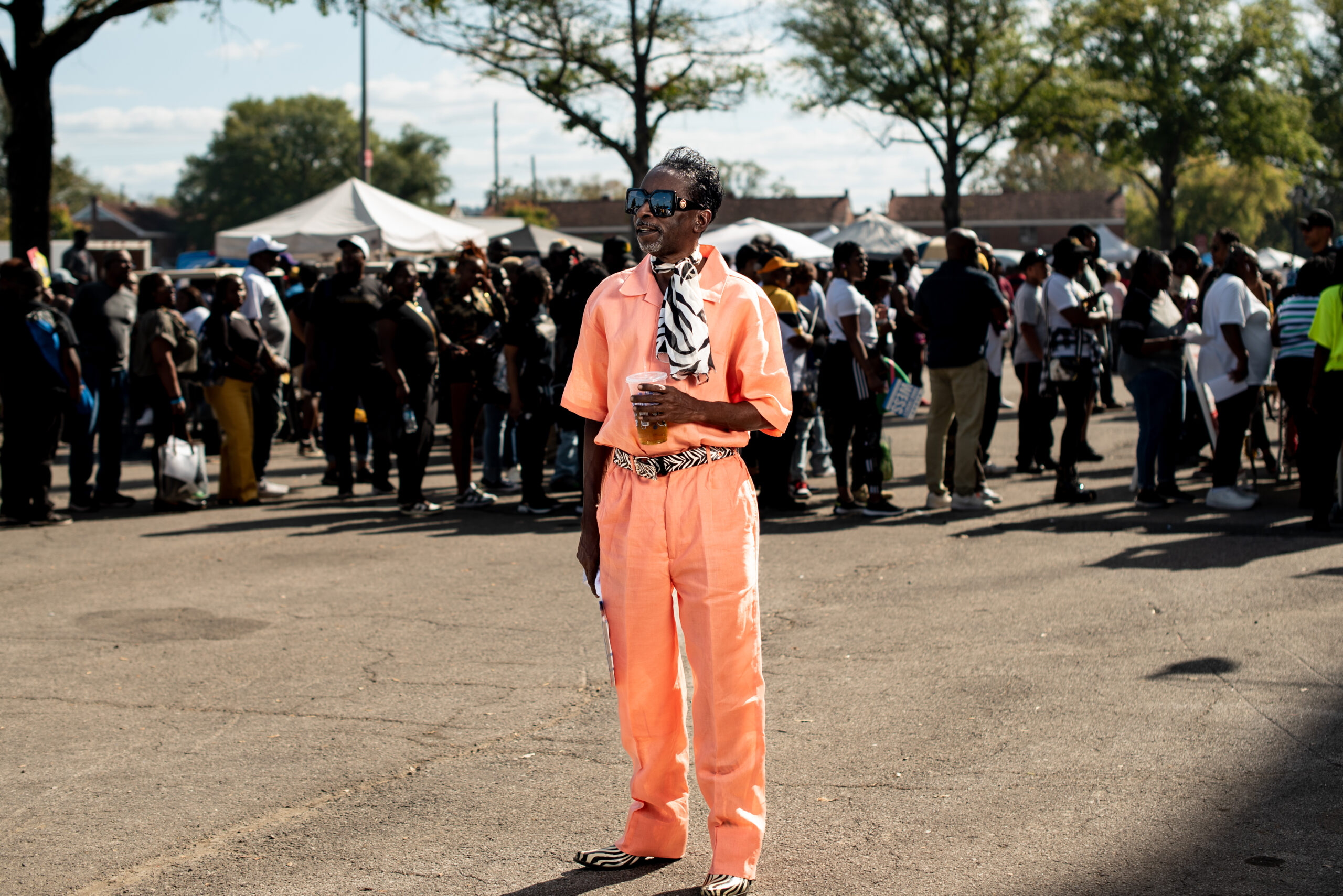 Tony Lykes wears an orange leisure suit with a zebra print scarf at the Magic City Classic in Birmingham, Alabama, U.S., on Saturday October 28th 2023.