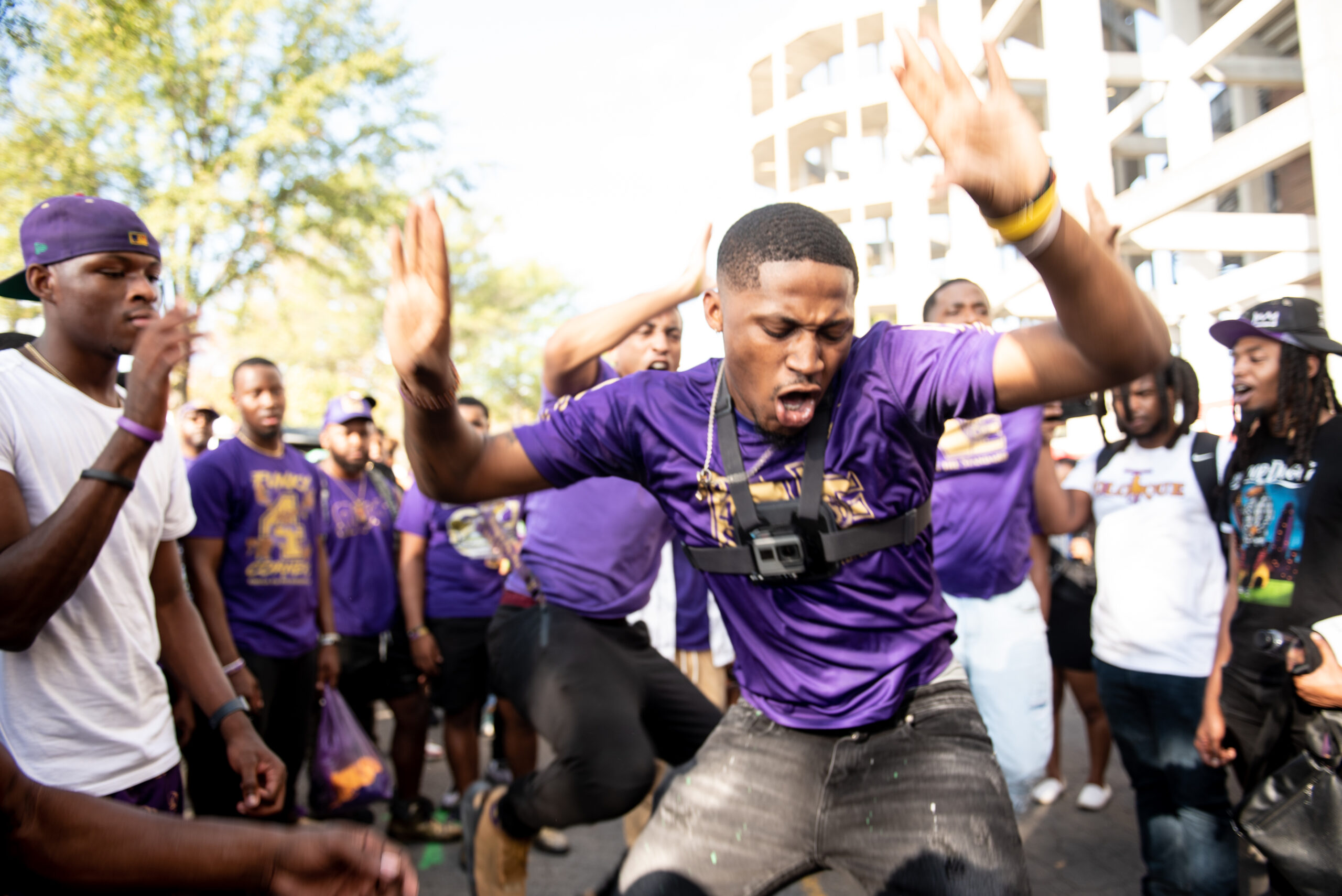 Members of Omega Psi Phi Fraternity, Inc dazzle the crowd with a march while tailgating at the Magic City Classic in Birmingham, Alabama, on Saturday, Oct. 28, 2023.