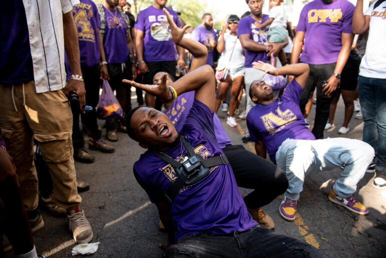 Members of Omega Psi Phi Fraternity, Inc dazzle the crowd with a march while tailgating at the Magic City Classic in Birmingham, Alabama, on Saturday, Oct. 28, 2023.