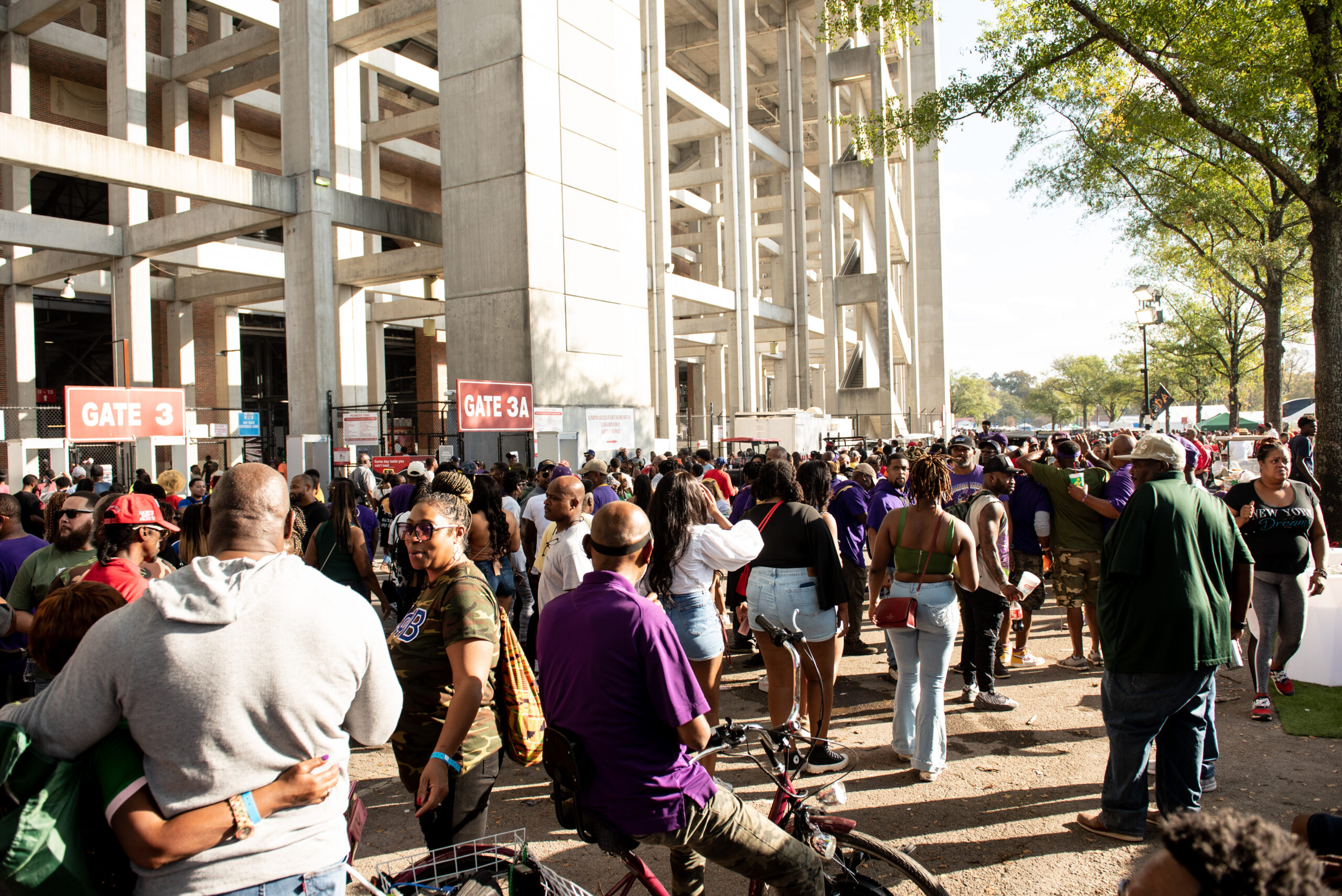 Crowd tailgate while waiting to enter Legion Field Stadium at the Magic City Classic in Birmingham, Alabama, on Saturday, Oct. 28, 2023.