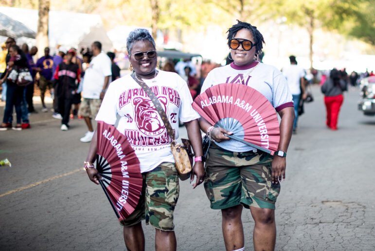 Sisters Tawanya Brown and Lantanya Brown represent their favorite school with a school logo tee and camouflage shorts at the Magic City Classic in Birmingham, Alabama, U.S., on Saturday October 28th 2023.