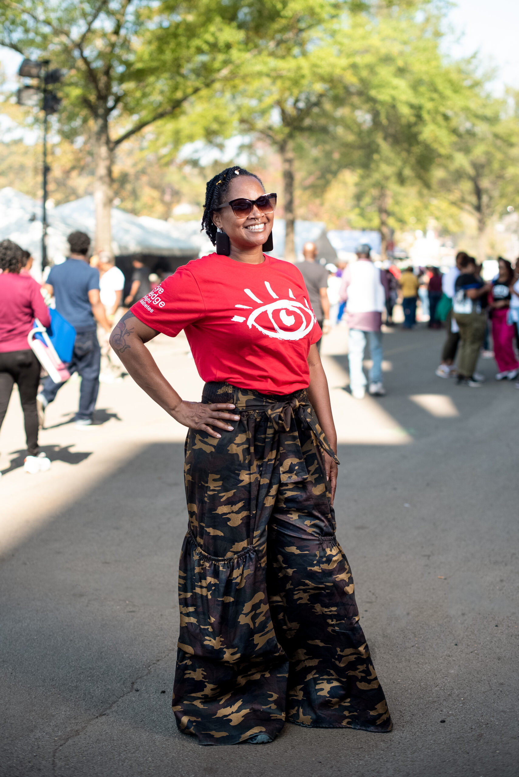 Leah Harrison wears red logo tee with graphic bellbottoms at the Magic City Classic in Birmingham, Alabama, U.S., on Saturday October 28th 2023.