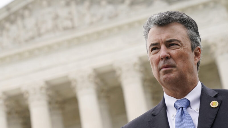 Alabama Attorney General Steve Marshall stand in front of the U.S. Supreme Court building.