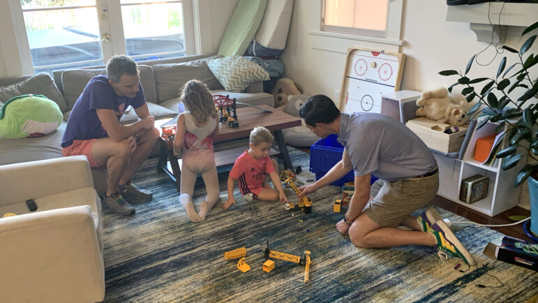 (From left to right) Tom, Isabel, Connor, and Jake Kleinmahon play in the living room of their New Orleans home on August 18, 2023