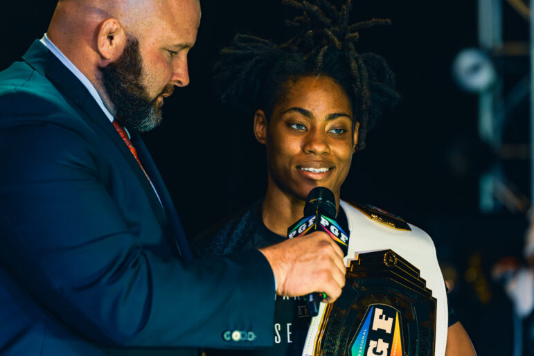 Nekiaya Jackson, Professional Grappling Federation's reigning women's champion, interviews with Stephen Eakin after her victory in the finale of the PGF's fifth season at the BComing Church in Decatur, Alabama, on Nov. 4, 2023.