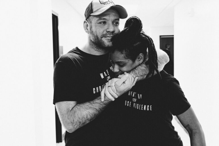 Brandon Mccaghren hugs Professional Grappling Federation's reigning women’s champion and 10th Planet grappler Nekiaya Jackson in this undated photo.