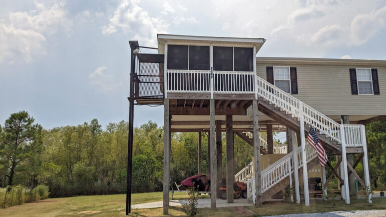 Homes in Clermont Harbor are built on stilts because future hurricanes are a threat.