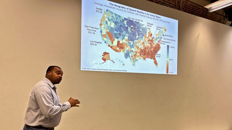Alex Lawson, chair for the Jackson Redevelopment Authority, shows residents an economic mobility map on Nov. 18, 2023, in Jackson, Mississippi, at the Mississippi State University School of Architecture.