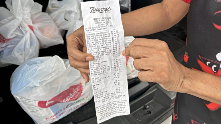 Bunny Young shows her grocery receipt after buying ingredients to make a pot of gumbo at Zuppardo’s Family Market in Metairie, Louisiana, on Dec. 8, 2023.