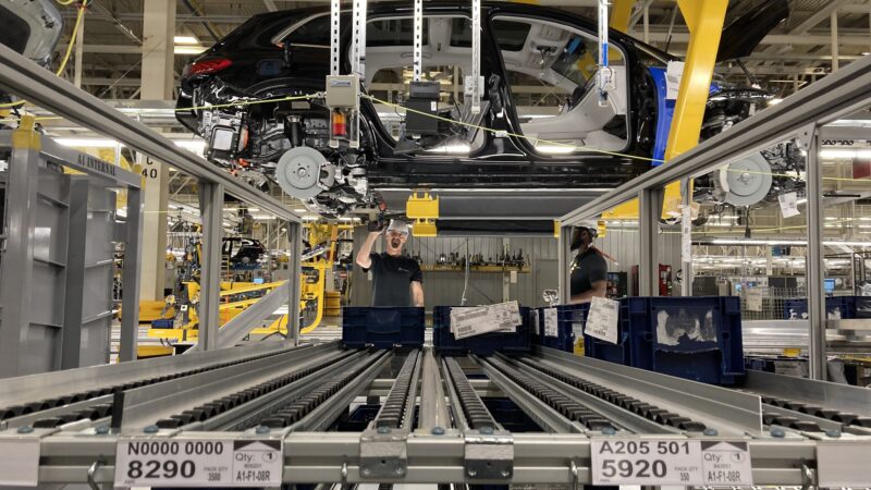 Workers at the Mercedes-Benz plant in Vance, Alabama, assemble an electric vehicle on Aug. 25, 2022.