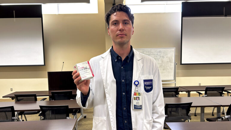 Jacob Bassin holds a box containing Narcan, a medication that can almost instantly reverse a life-threatening opioid overdose, at the UQ-Ochsner Clinical School in New Orleans on January 11, 2024.