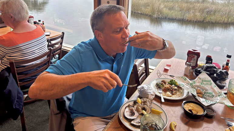 Jeremy Sullivan eats an oyster at the Original Oyster House in Gulf Shores, Alabama, on Feb. 9, 2024.