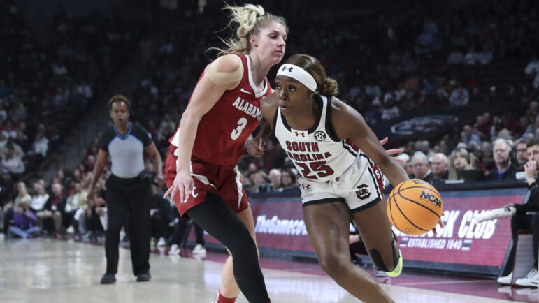 South Carolina guard Raven Johnson (25) drives to the basket past Alabama guard Sarah Ashlee Barker (3) during the first half of an NCAA college basketball game Thursday, Feb. 22, 2024, in Columbia, S.C.