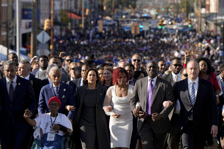 The Rev. Al Sharpton, Vice President Kamala Harris Attorney Ben Crump and the second gentleman of the United States Douglas Emhoff walk with hundreds of people across the Edmund Pettus Bridge.