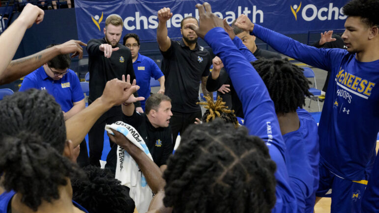 McNeese coach Will Wade, center, talks to the team during a timeout in an NCAA college basketball game against New Orleans in New Orleans, Wednesday, March 6, 2024.